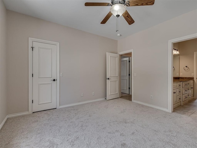 1233 Autumn Creek Dr, Edmond, OK 73003 - unfurnished bedroom with light colored carpet, ensuite bathroom, and ceiling fan