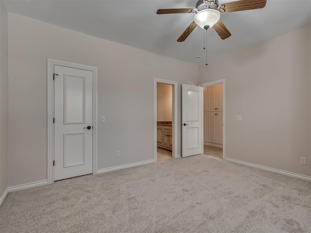 1233 Autumn Creek Dr, Edmond, OK 73003 - unfurnished bedroom with light colored carpet, ensuite bathroom, and ceiling fan
