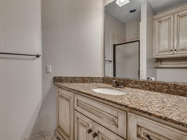 1233 Autumn Creek Dr, Edmond, OK 73003 - full bath featuring vanity, a stall shower, and tile patterned floors