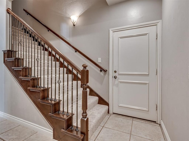 1233 Autumn Creek Dr, Edmond, OK 73003 - stairway with baseboards and tile patterned floors