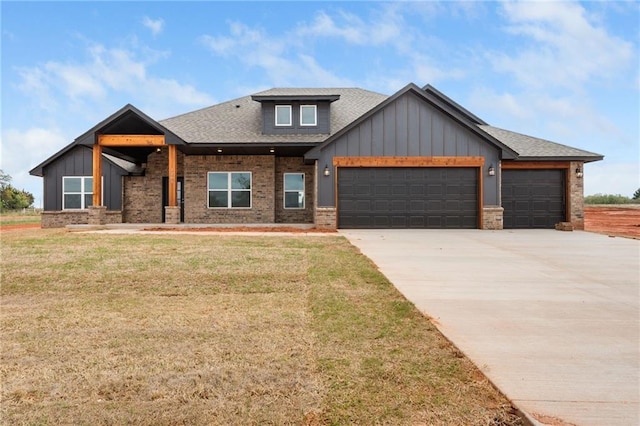 2344 Knox Ln, Blanchard, OK 73010 - view of front of house with board and batten siding, a garage, a front yard, a shingled roof, and concrete driveway
