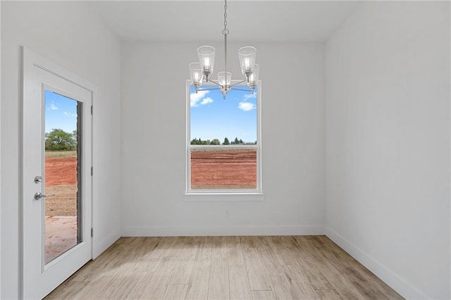 2344 Knox Ln, Blanchard, OK 73010 - empty room with a chandelier and light wood-type flooring