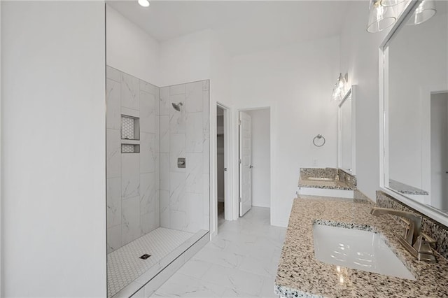 2344 Knox Ln, Blanchard, OK 73010 - bathroom featuring marble look tiles, tiled shower, double vanity, and recessed lighting