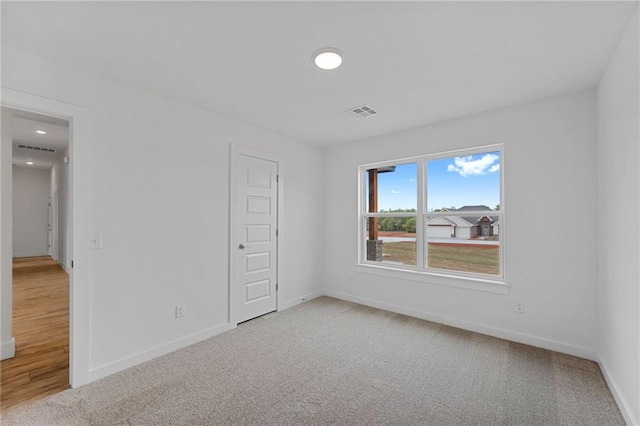 2344 Knox Ln, Blanchard, OK 73010 - spare room featuring light carpet and recessed lighting