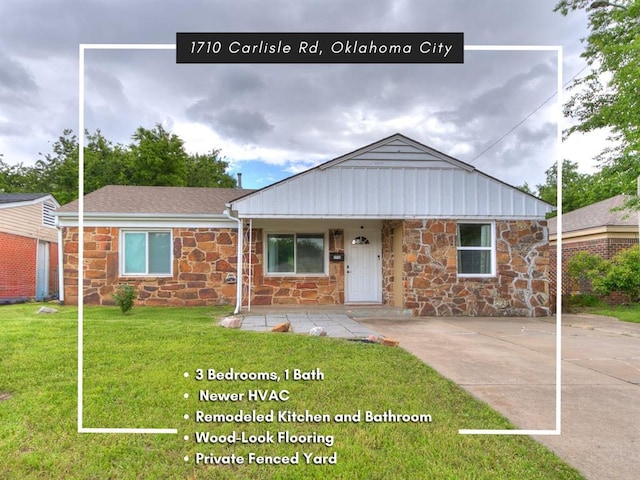 1710 Carlisle Rd, Oklahoma City, OK 73120 - view of front of house featuring stone siding, a front yard, and a porch