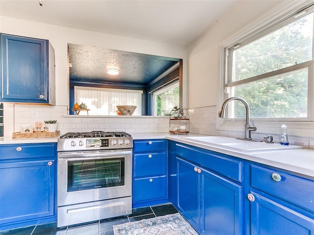 1710 Carlisle Rd, Oklahoma City, OK 73120 - kitchen featuring gas range and blue cabinetry