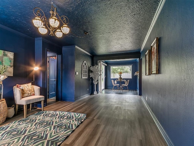 1710 Carlisle Rd, Oklahoma City, OK 73120 - hallway with a chandelier, wood finished floors, crown molding, and a textured ceiling