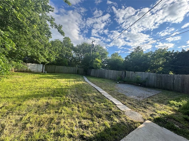 1710 Carlisle Rd, Oklahoma City, OK 73120 - fenced backyard with a patio area