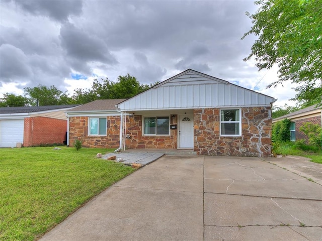 1710 Carlisle Rd, Oklahoma City, OK 73120 - view of front of property with stone siding and a front yard