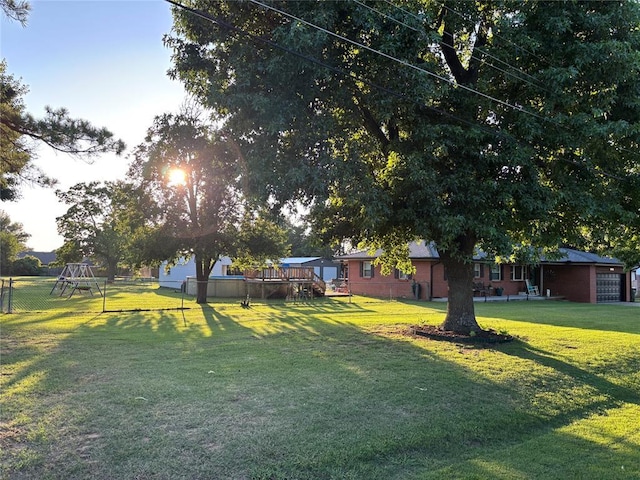 1717 S Webster Dr, Midwest City, OK 73130 - fenced backyard featuring a playground