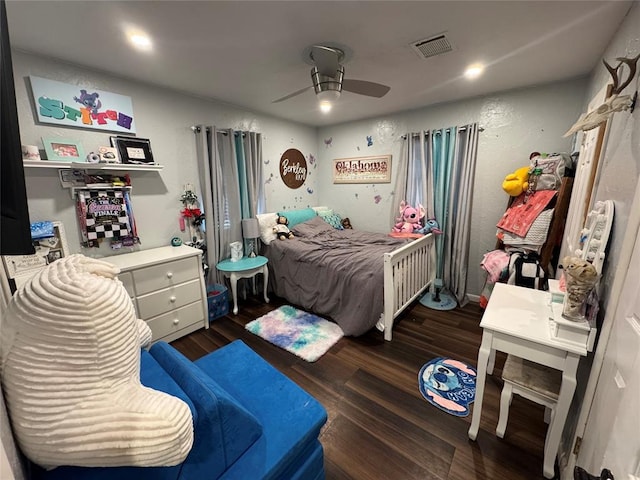 1717 S Webster Dr, Midwest City, OK 73130 - bedroom with wood finished floors and a ceiling fan