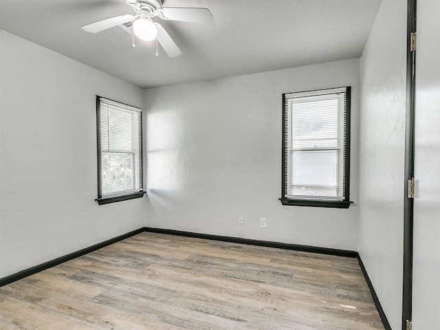 3225 SE 20th St, Oklahoma City, OK 73115 - empty room with plenty of natural light, wood finished floors, and a ceiling fan