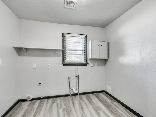 3225 SE 20th St, Oklahoma City, OK 73115 - washroom with light wood-style floors, electric dryer hookup, and washer hookup