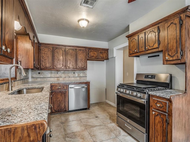 201 N Base Ave, Norman, OK 73069 - kitchen with stainless steel appliances and backsplash