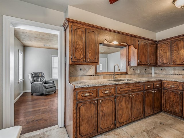 201 N Base Ave, Norman, OK 73069 - kitchen featuring backsplash and light tile patterned flooring