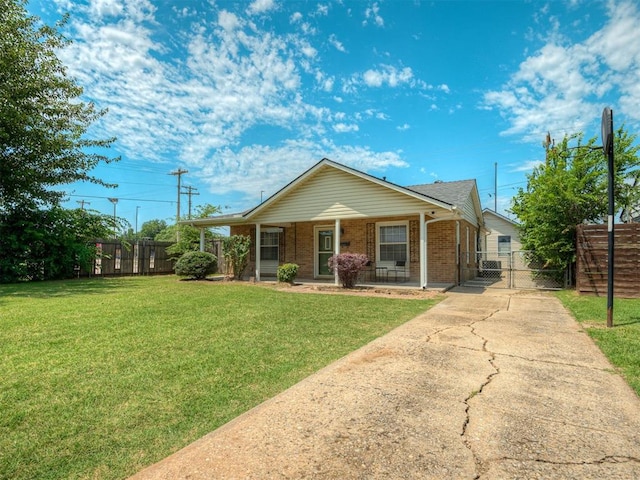 201 N Base Ave, Norman, OK 73069 - view of front of home with a gate, brick siding, and a porch