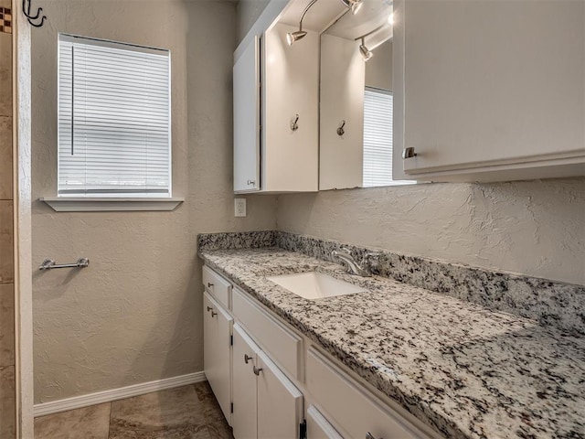 201 N Base Ave, Norman, OK 73069 - bathroom with a textured wall and vanity