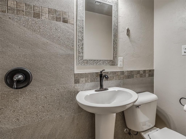 201 N Base Ave, Norman, OK 73069 - half bathroom with toilet and tile walls