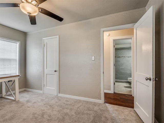 201 N Base Ave, Norman, OK 73069 - unfurnished bedroom with carpet floors, crown molding, and a ceiling fan