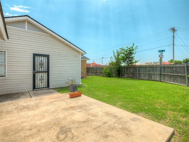 201 N Base Ave, Norman, OK 73069 - fenced backyard with a patio area