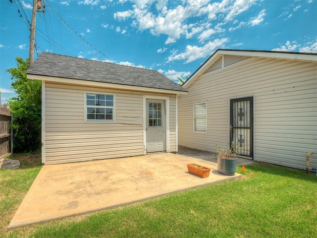 201 N Base Ave, Norman, OK 73069 - rear view of house with a patio area, a yard, and roof with shingles