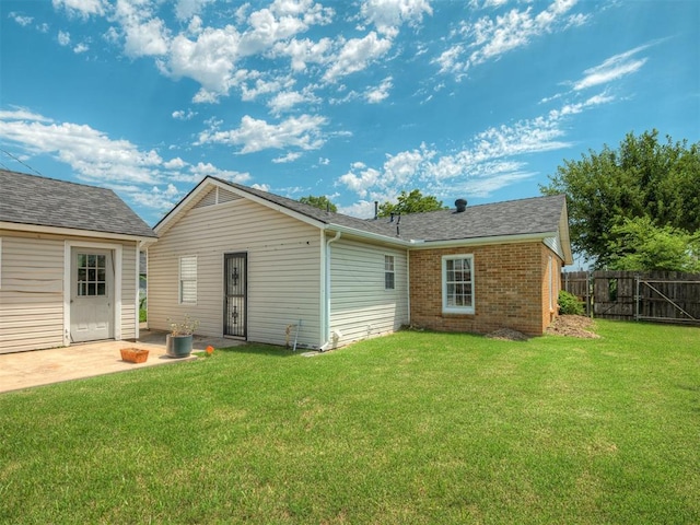 201 N Base Ave, Norman, OK 73069 - rear view of property with brick siding, a patio area, and a shingled roof
