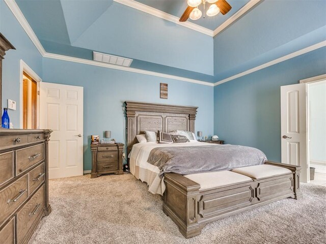 1621 NW 182nd St, Edmond, OK 73012 - carpeted bedroom featuring crown molding, a ceiling fan, and a raised ceiling