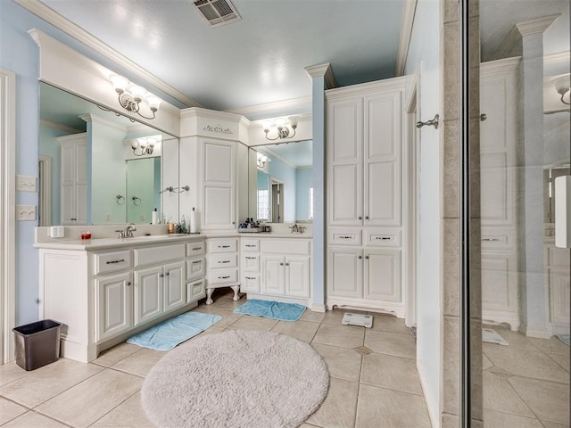 1621 NW 182nd St, Edmond, OK 73012 - full bath with ornamental molding, double vanity, a shower stall, tile patterned floors, and a chandelier