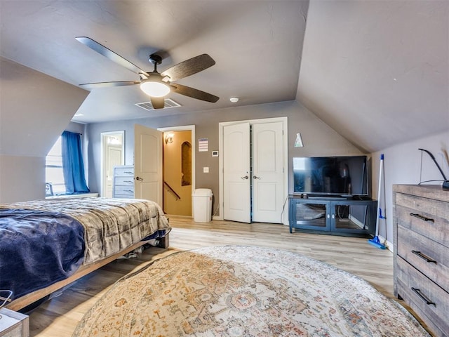 1621 NW 182nd St, Edmond, OK 73012 - bedroom with lofted ceiling, wood finished floors, a ceiling fan, and ensuite bathroom