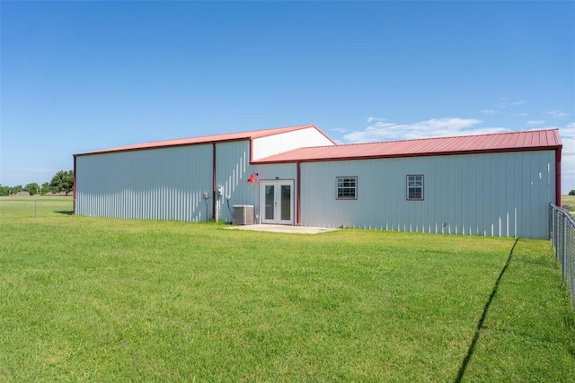 27919 Tortola Ln, Blanchard, OK 73010 - rear view of house featuring french doors, a pole building, and a metal roof