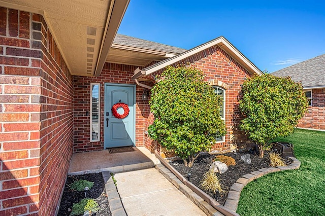 1613 NW 124th St, Oklahoma City, OK 73120 - entrance to property featuring brick siding and roof with shingles