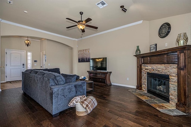 1613 NW 124th St, Oklahoma City, OK 73120 - living room featuring ceiling fan, hardwood / wood-style flooring, ornamental molding, a fireplace, and arched walkways