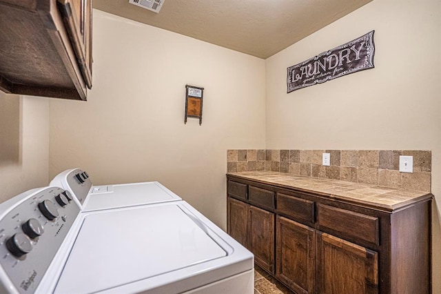 1613 NW 124th St, Oklahoma City, OK 73120 - washroom featuring washer and dryer and cabinet space