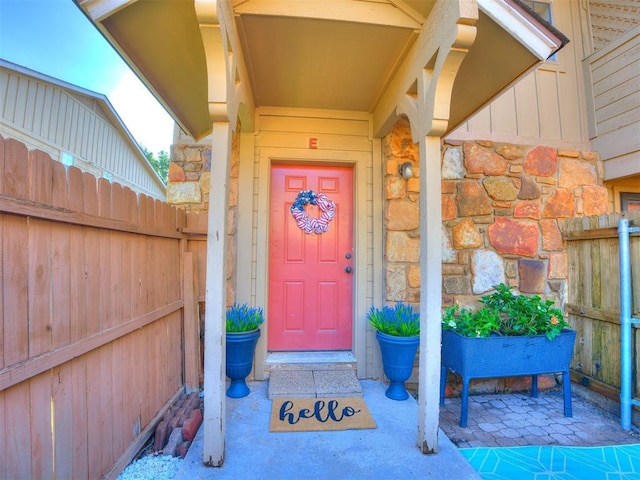 14313 N Pennsylvania Ave Unit 7E, Oklahoma City, OK 73134 - entrance to property featuring board and batten siding and stone siding