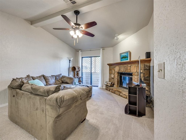 14313 N Pennsylvania Ave Unit 7E, Oklahoma City, OK 73134 - living area with carpet, a textured wall, ceiling fan, and a fireplace