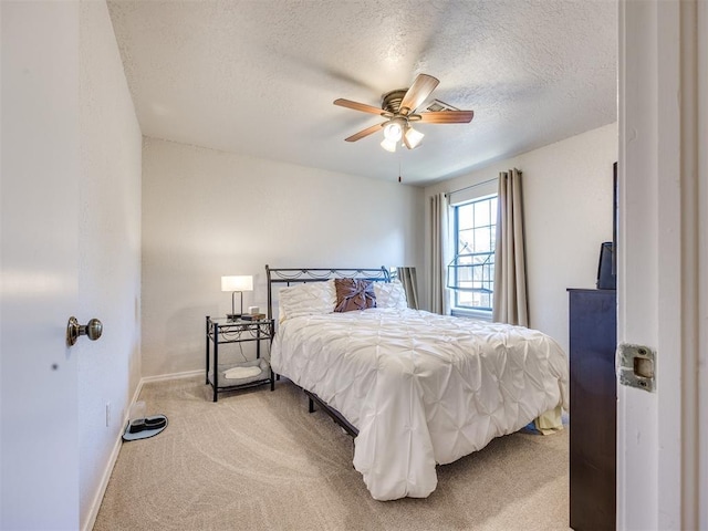 14313 N Pennsylvania Ave Unit 7E, Oklahoma City, OK 73134 - carpeted bedroom featuring a textured ceiling and ceiling fan
