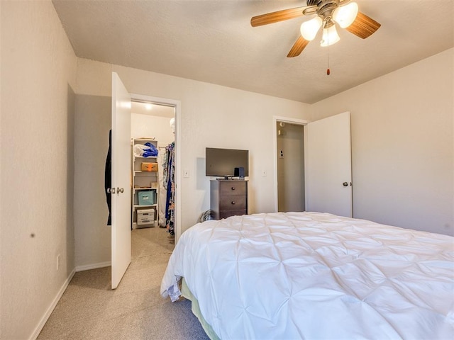 14313 N Pennsylvania Ave Unit 7E, Oklahoma City, OK 73134 - bedroom with light carpet, a spacious closet, and ceiling fan