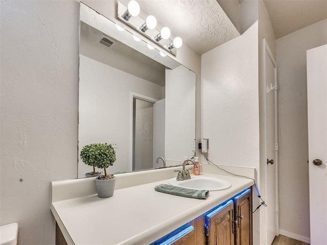 14313 N Pennsylvania Ave Unit 7E, Oklahoma City, OK 73134 - bathroom with vanity and toilet