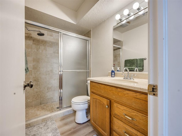 14313 N Pennsylvania Ave Unit 7E, Oklahoma City, OK 73134 - full bath with vanity, a shower stall, and wood finished floors