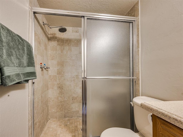 14313 N Pennsylvania Ave Unit 7E, Oklahoma City, OK 73134 - bathroom featuring a shower stall, vanity, and a textured wall