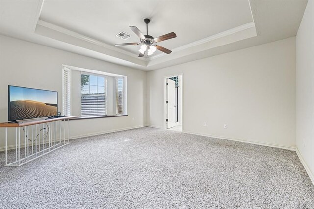 9716 SW 21st Ter, Oklahoma City, OK 73128 - carpeted empty room featuring a raised ceiling, a ceiling fan, and crown molding