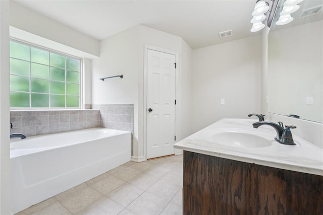 9716 SW 21st Ter, Oklahoma City, OK 73128 - bathroom with a garden tub, tile patterned floors, double vanity, and a chandelier
