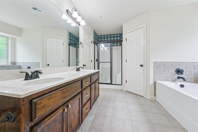 9716 SW 21st Ter, Oklahoma City, OK 73128 - full bath featuring a bath, double vanity, tile patterned floors, and a stall shower
