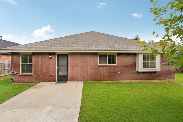 9716 SW 21st Ter, Oklahoma City, OK 73128 - view of front of property featuring a shingled roof, a patio, and brick siding