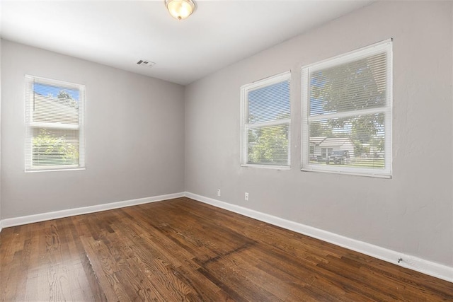 3919 SE 10th Pl, Oklahoma City, OK 73115 - empty room with baseboards and dark wood-style floors