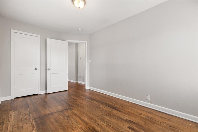 3919 SE 10th Pl, Oklahoma City, OK 73115 - unfurnished bedroom with wood finished floors and baseboards