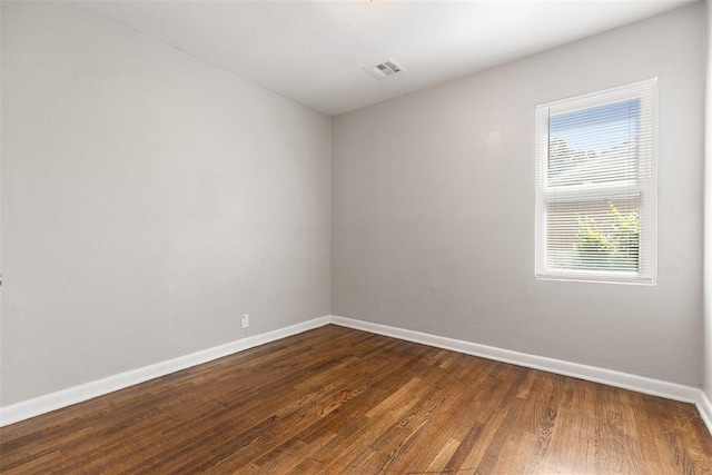 3919 SE 10th Pl, Oklahoma City, OK 73115 - unfurnished room featuring baseboards and dark wood finished floors