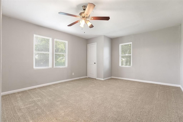 3919 SE 10th Pl, Oklahoma City, OK 73115 - spare room with light carpet, plenty of natural light, and ceiling fan