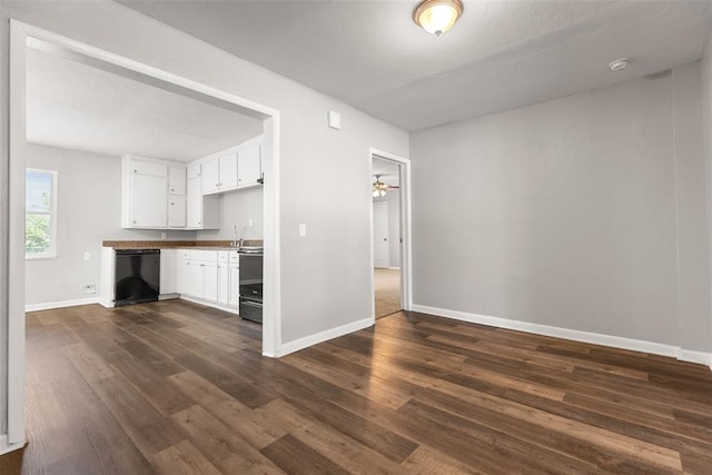 3919 SE 10th Pl, Oklahoma City, OK 73115 - kitchen with dishwasher, dark wood finished floors, white cabinets, and range