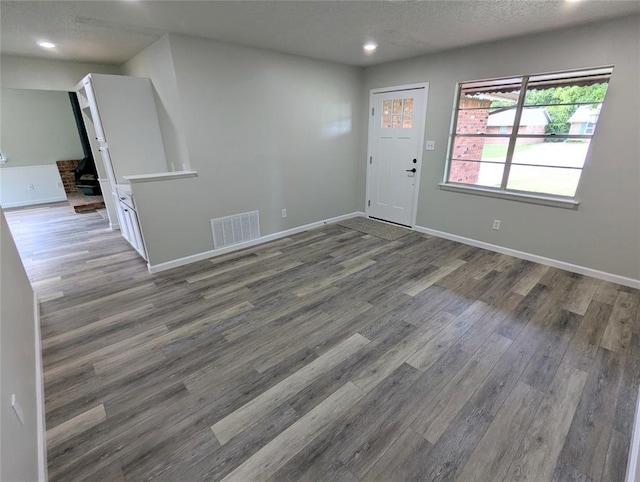 104 SW 10th St, Moore, OK 73160 - entryway featuring recessed lighting, wood finished floors, and a textured ceiling